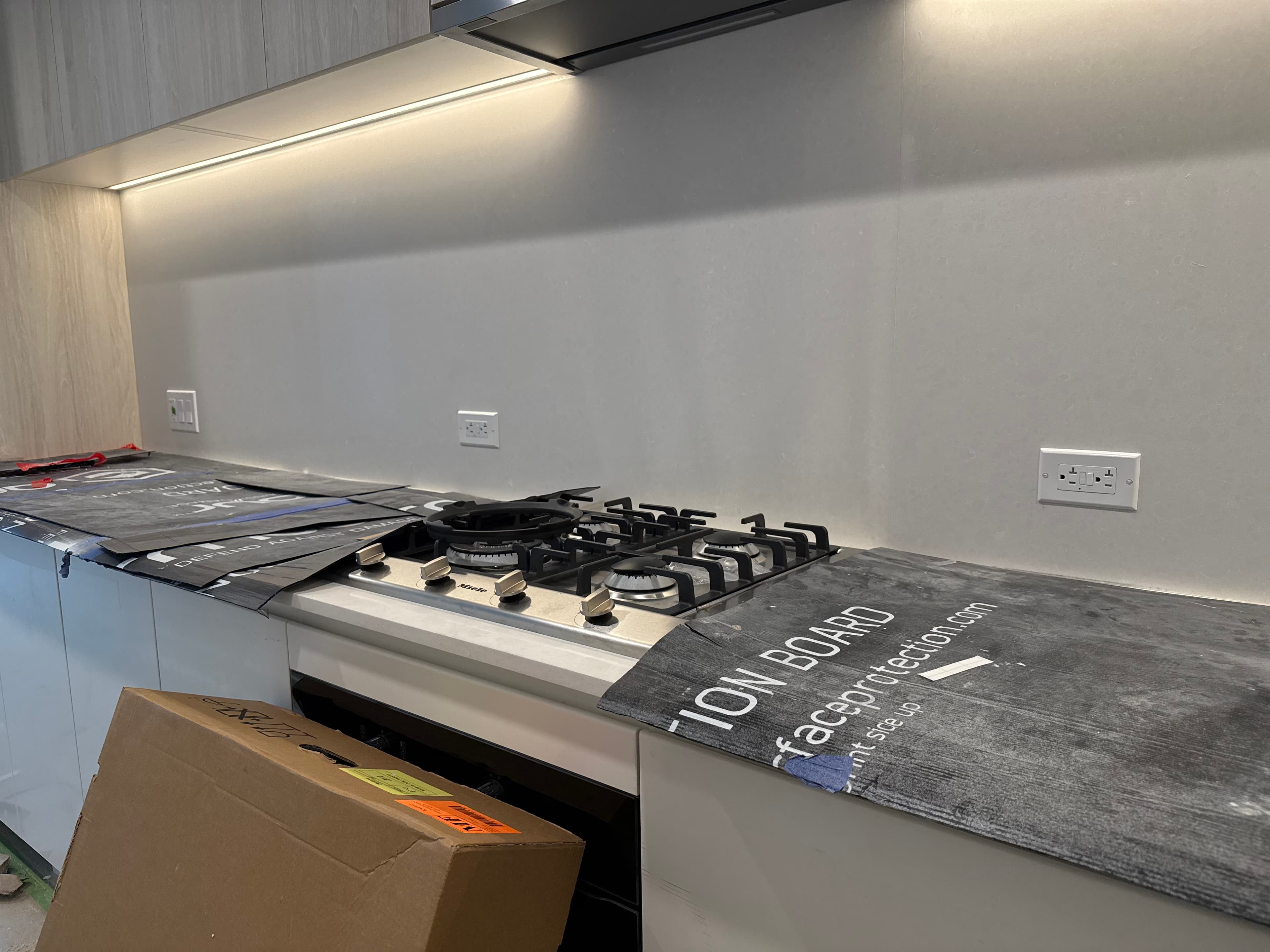 Kitchen with under cabinet lighting and finished electrical outlets