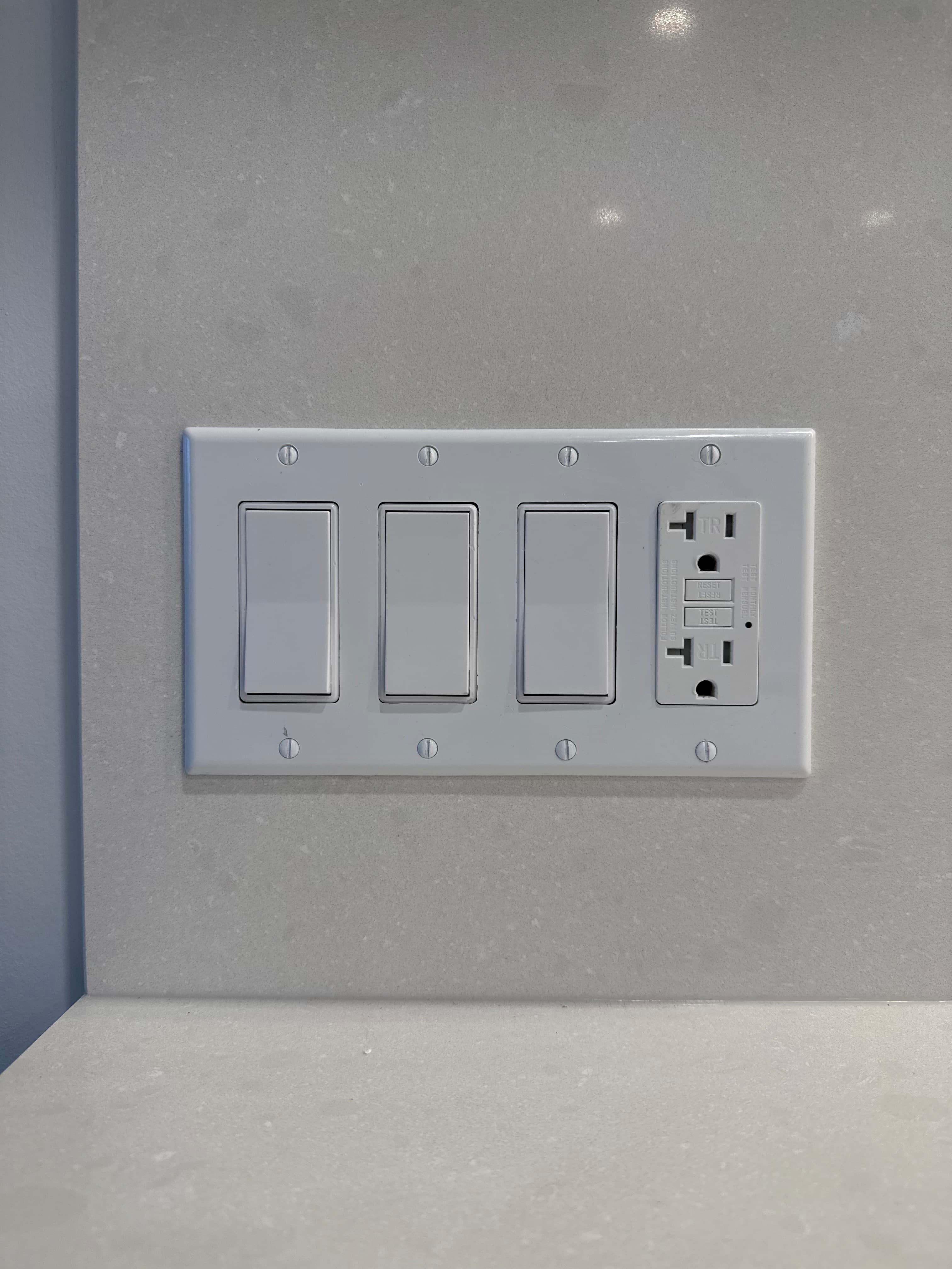 Illustrative image of finished switches and a receptacle